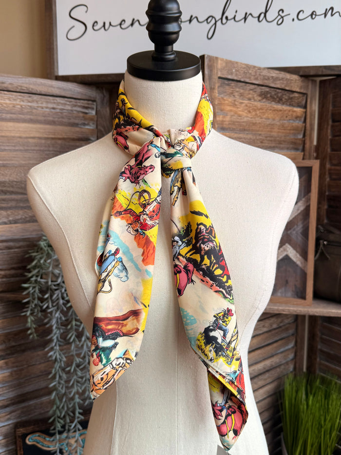 Western wild rag scarf with multicolor cowboy print, neatly tied on mannequin
