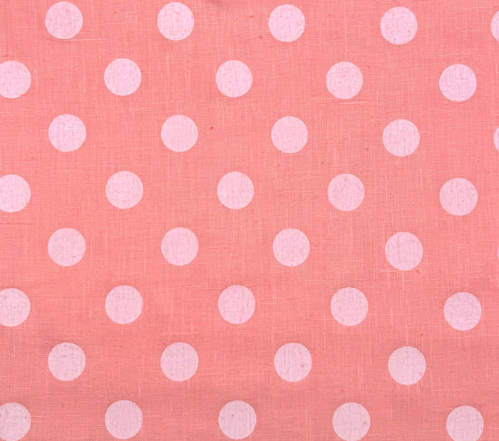 Pink fabric with white polka dots