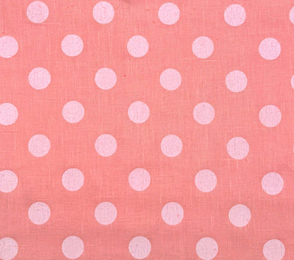 Pink fabric with white polka dots