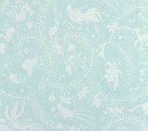 A fabric with a Chinoiserie print featuring Javanese mythological animals, swirling vines, and flowers on a light blue background.