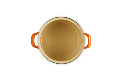 Beige inside stockpot with flame handles on a white background