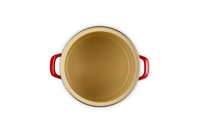 Beige inside stockpot with cerise handles on a white background