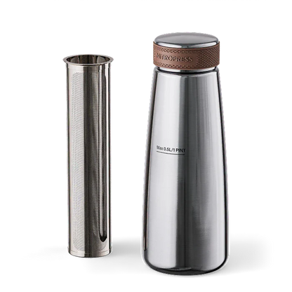 A stainless steel travel tumbler with a matching metal travel sleeve, shown on a clean white background. The tumbler features a textured brown leather accent band around the lid and the brand name 'Nitropress' printed on the lid.