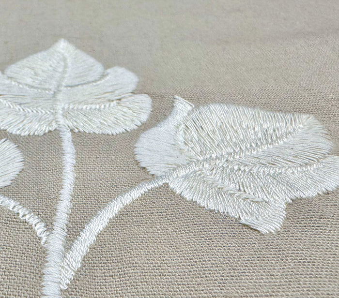 Quadrille Fabric: Botanica - White Embroidered on Gray Cotton