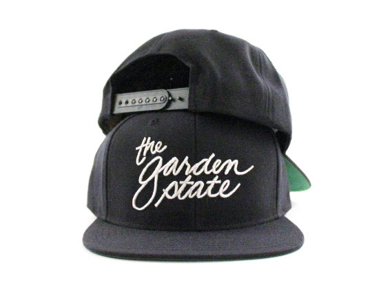The Garden State Script Snapback Hats (Navy Green Under Brim)