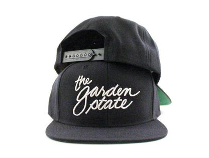 The Garden State Script Snapback Hats (Navy Green Under Brim)
